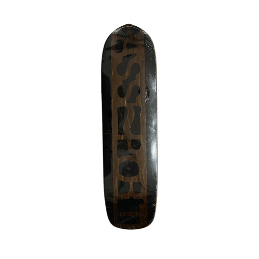 Skateboard deck with a black pattern on a white surface