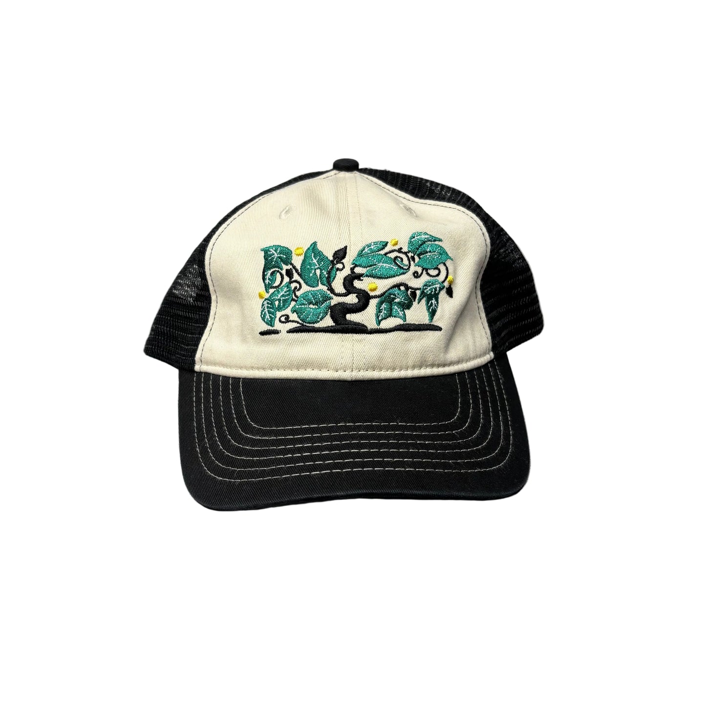 Black and white cap with a decorative design on a white background