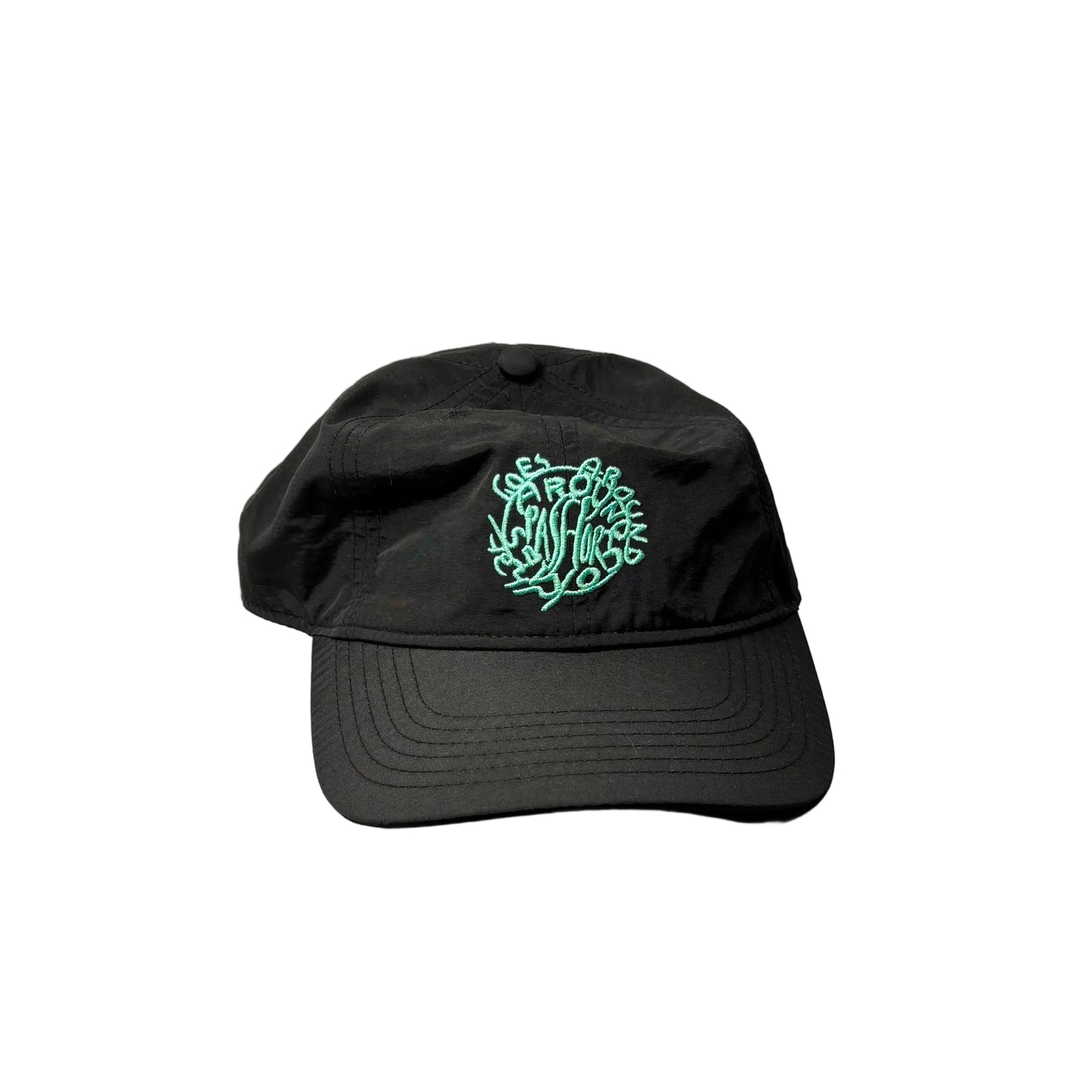 Black cap with a green logo on a white background