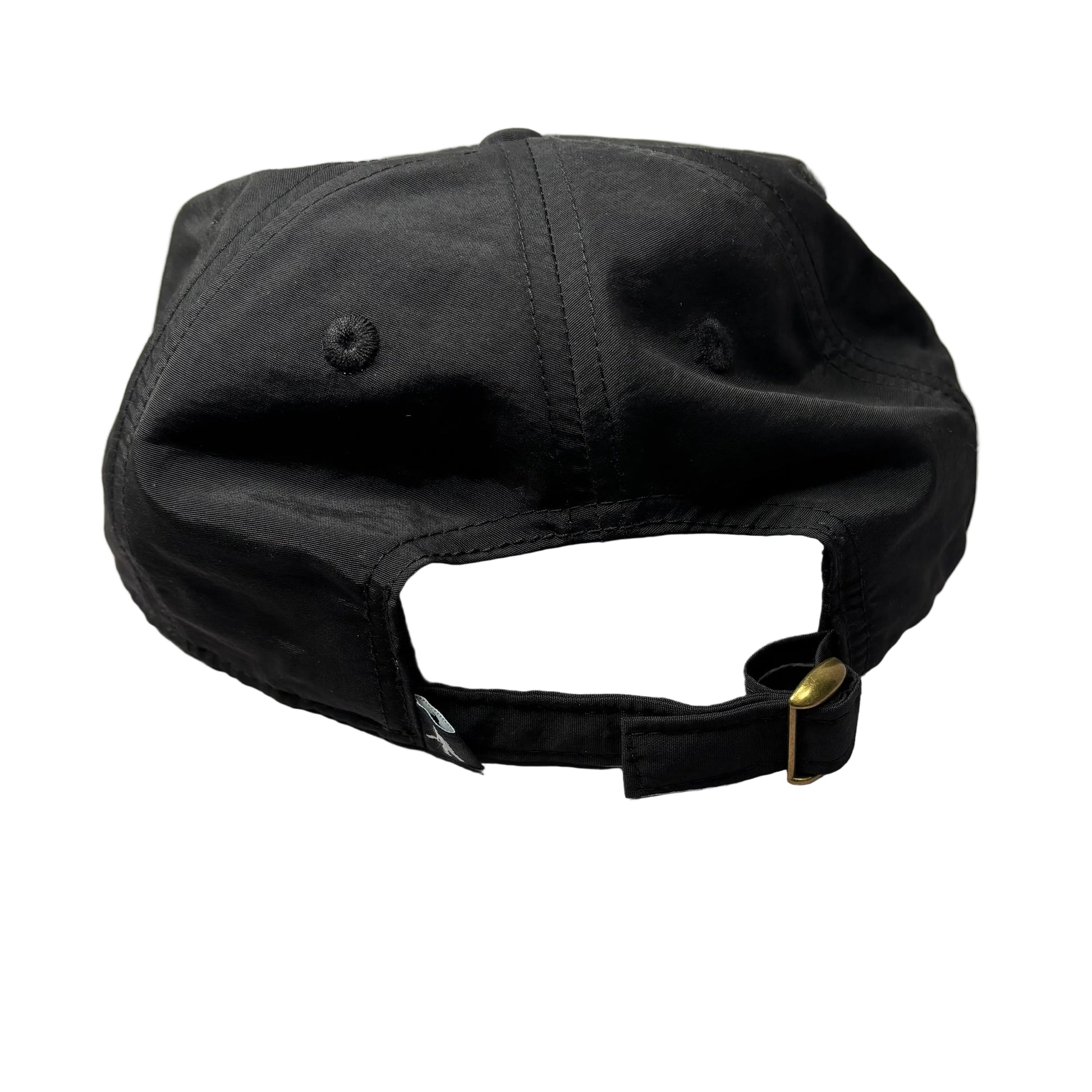 Black cap on a white surface