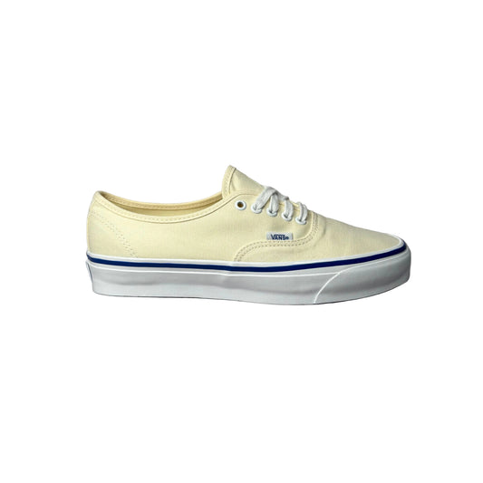 White sneaker with blue stripe on a white background