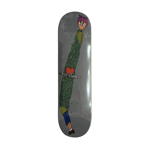 Skateboard deck with a colorful graphic of a character on a white surface.