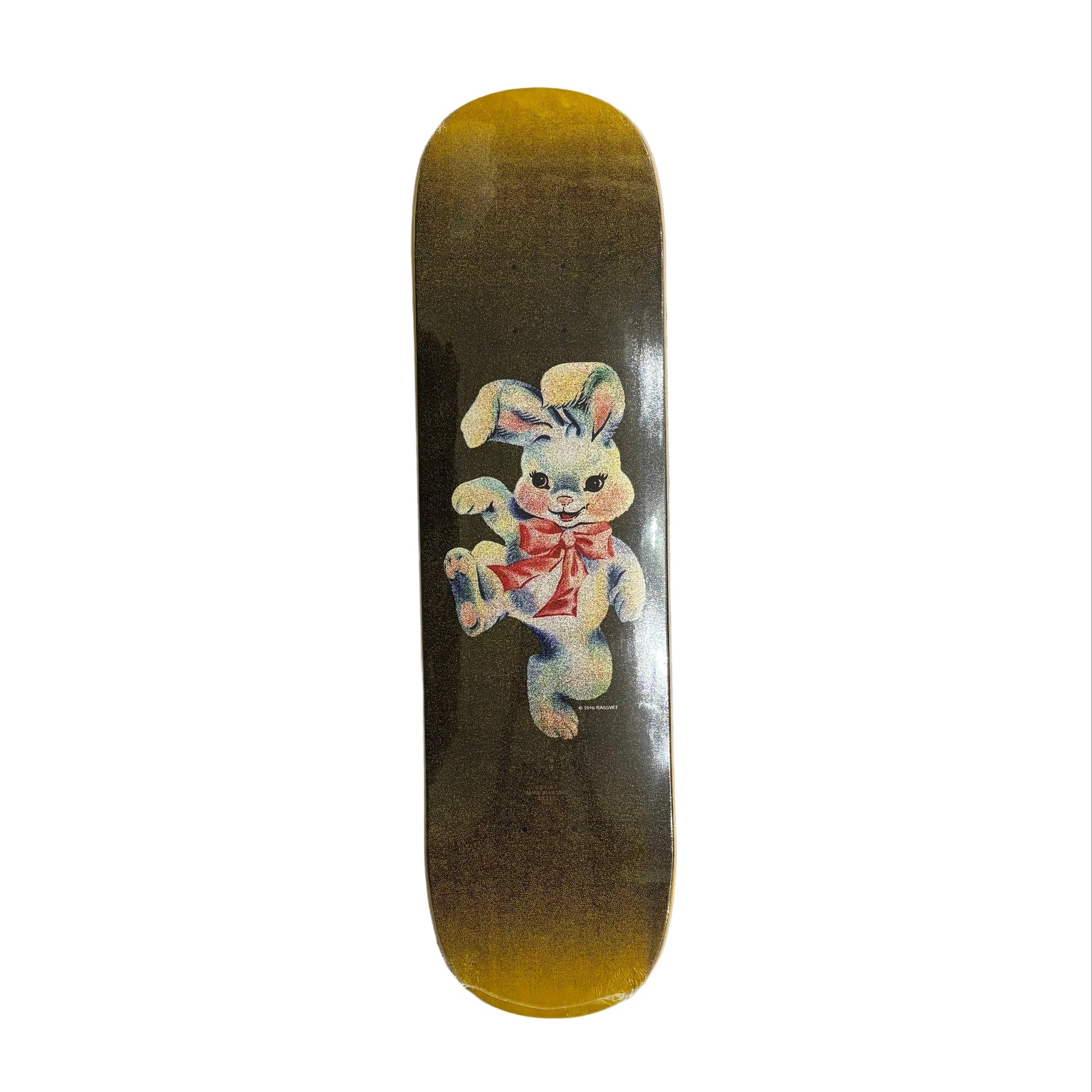Skateboard deck with a cartoon bunny design on a white surface