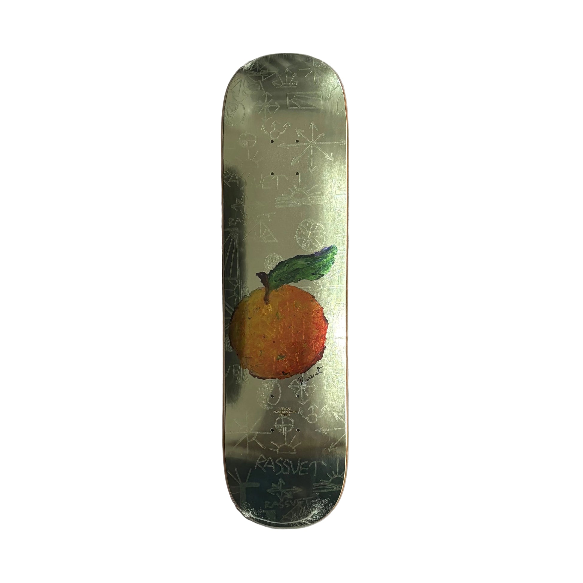 Skateboard deck with a tangerine and leaf design on a white surface