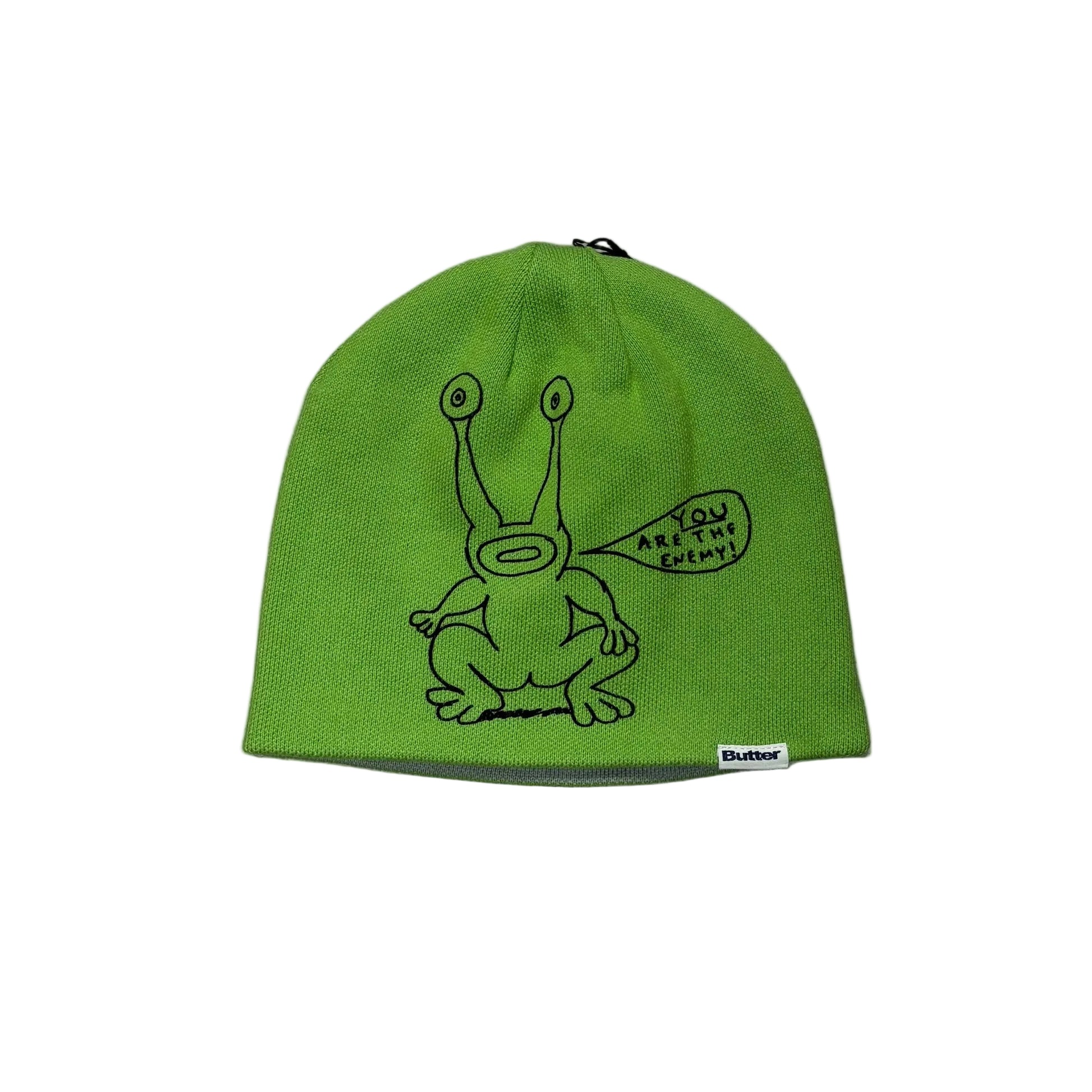 Green beanie with a cartoon character on a white background