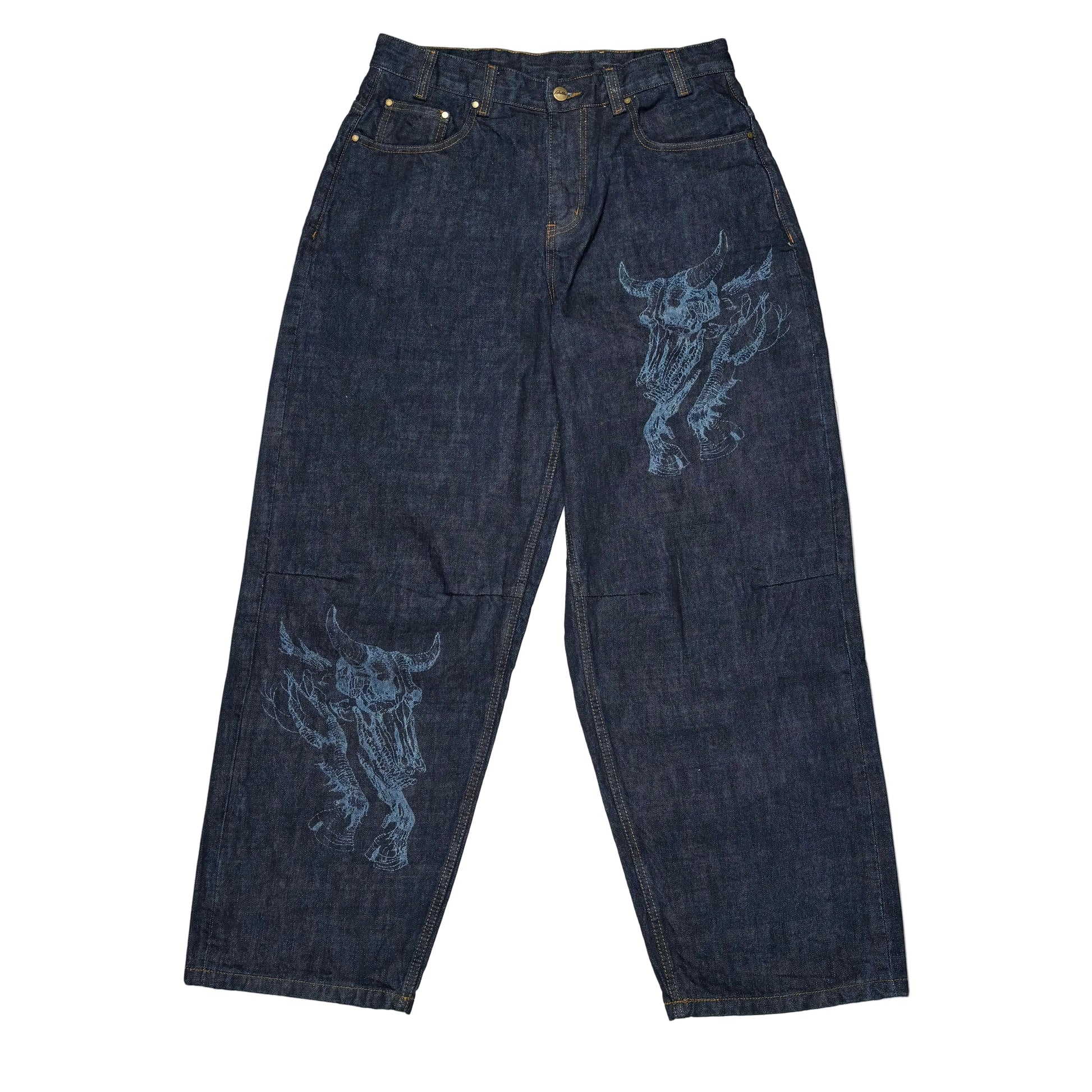 Dark blue jeans with bull skull designs on a white surface