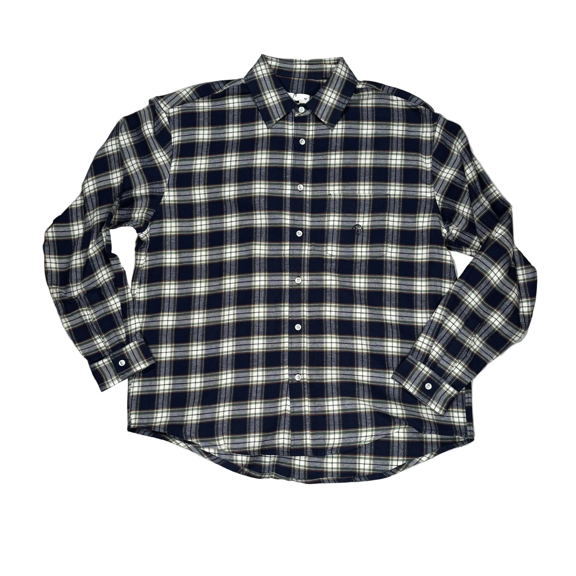 Black and white plaid shirt on a gray surface with wooden borders