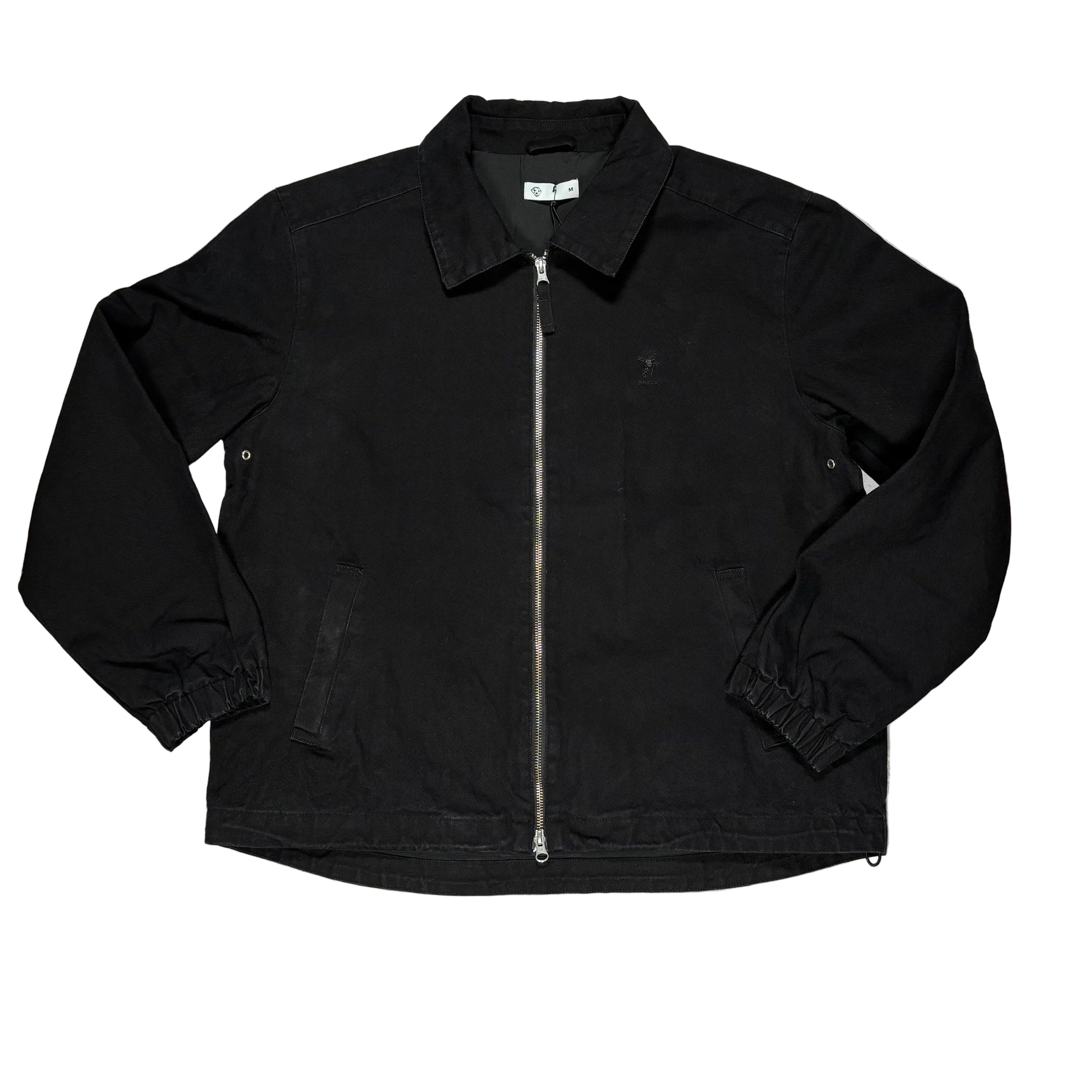 Black jacket on a white surface 