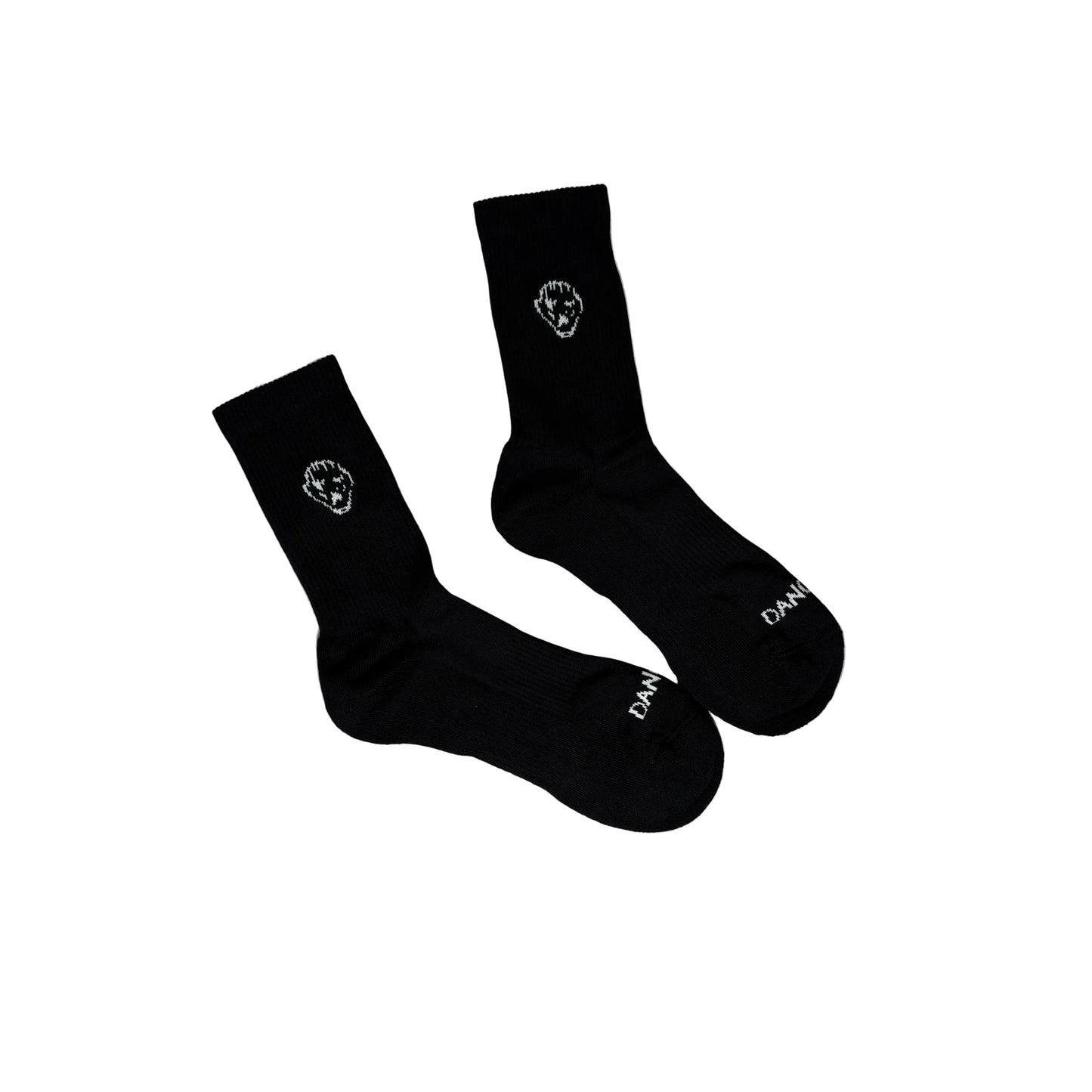Black socks with white logos on a white surface