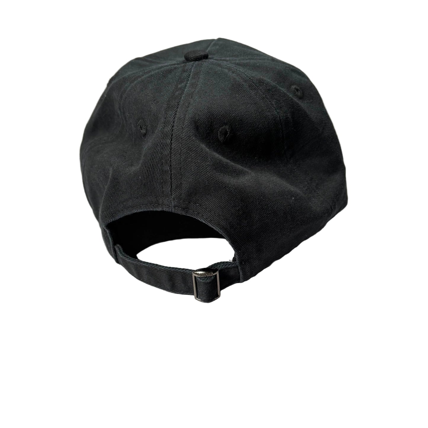 Black baseball cap on a white surface