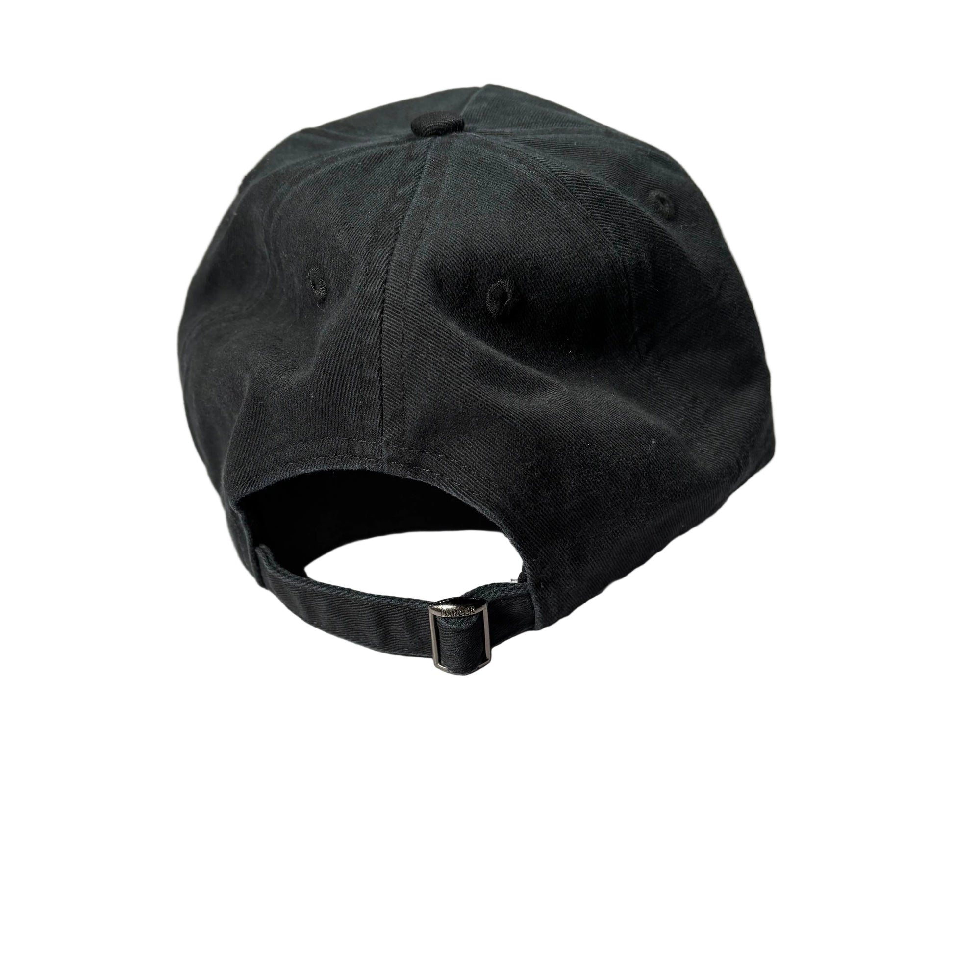 Black baseball cap on a white surface