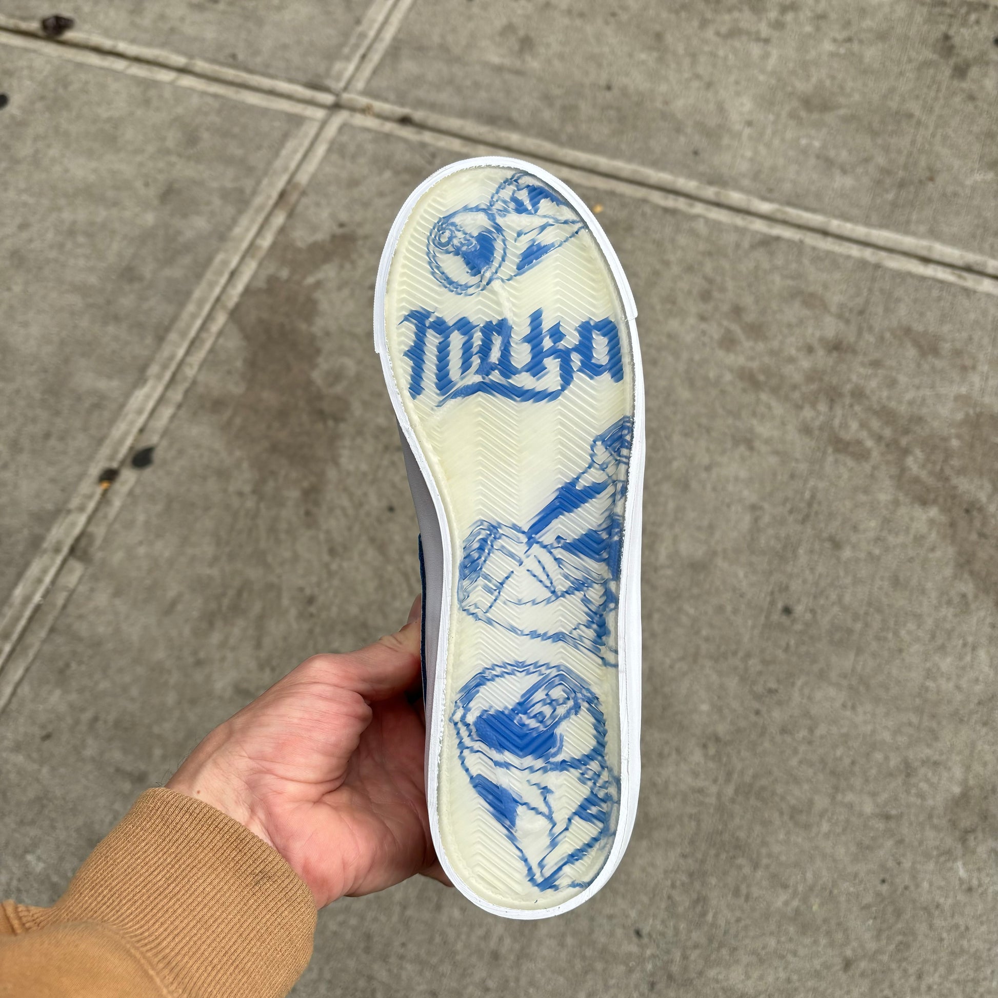 View of clear outsole on white/blue nike skateboard sneaker