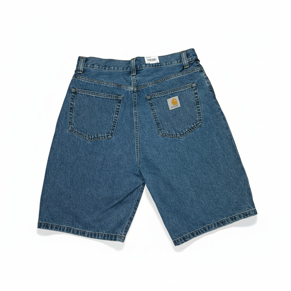 Blue denim shorts with a brand logo on a white surface