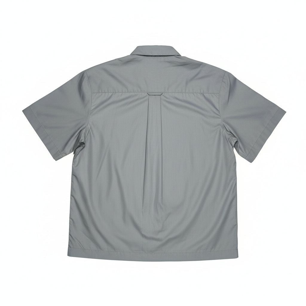 blue/Gray short-sleeve shirt on a white surface 