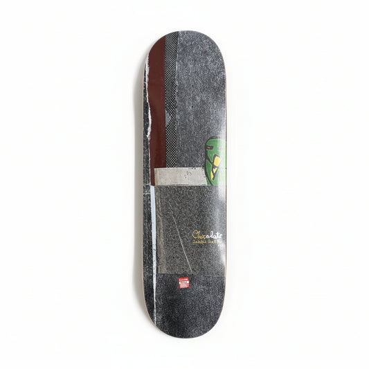 Skateboard deck with a graphic design on a white surface