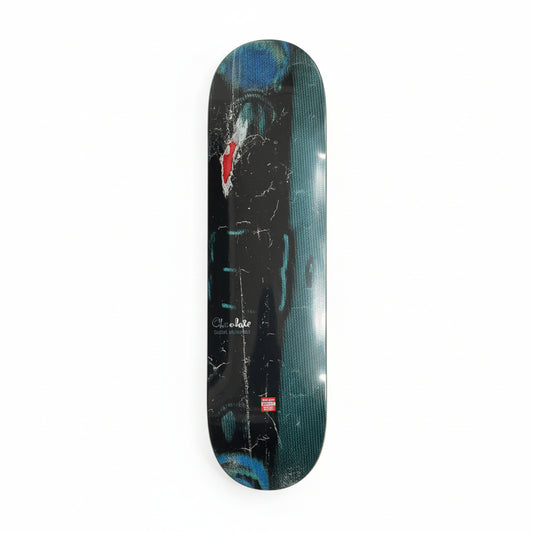 Skateboard deck with a black and blue design on a white surface