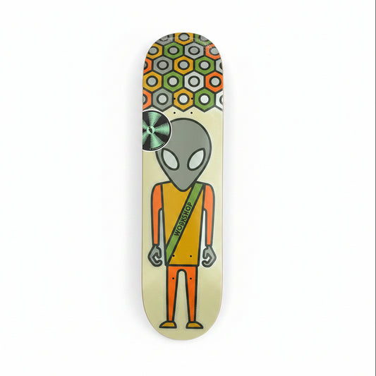 Skateboard deck with alien design on a white surface