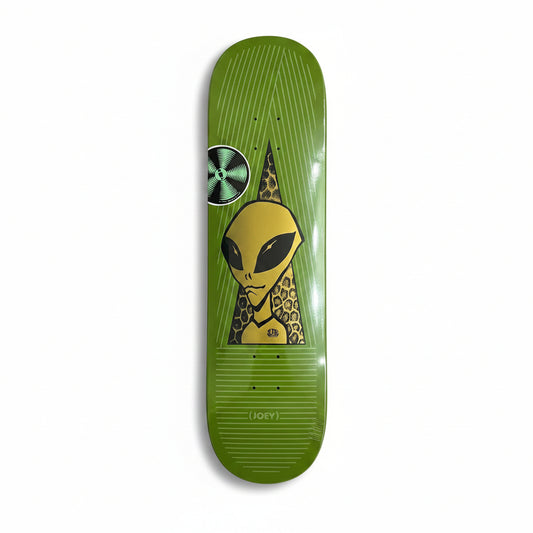 Green skateboard deck with alien design on a white surface