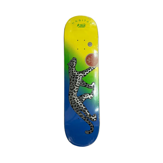 Skateboard deck with a leopard design on a white surface