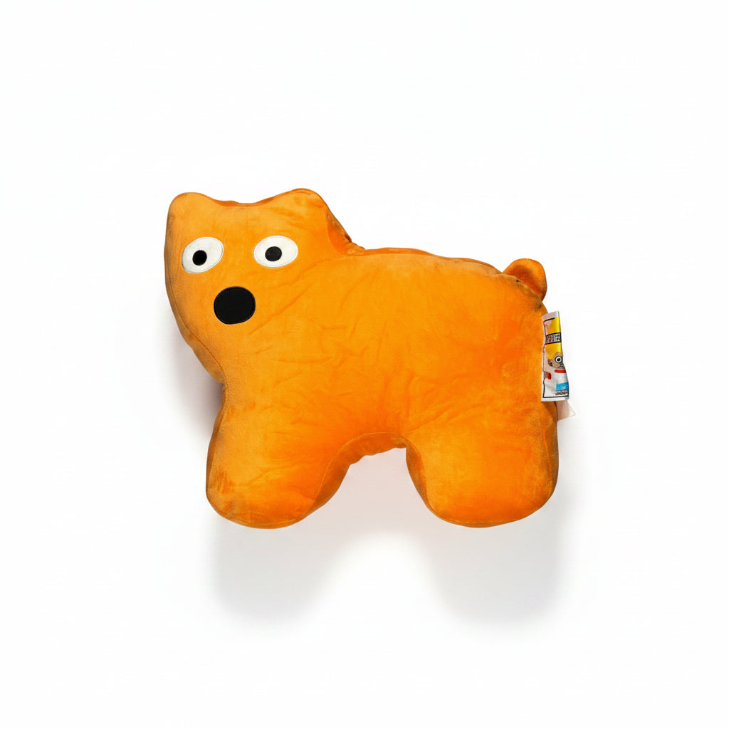 Orange plush toy with googly eyes on a white surface