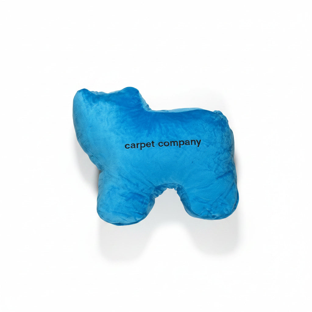 Blue plush toy with 'carpet company' text on a white background