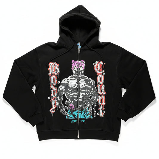 Black hoodie with graphic design on a white surface