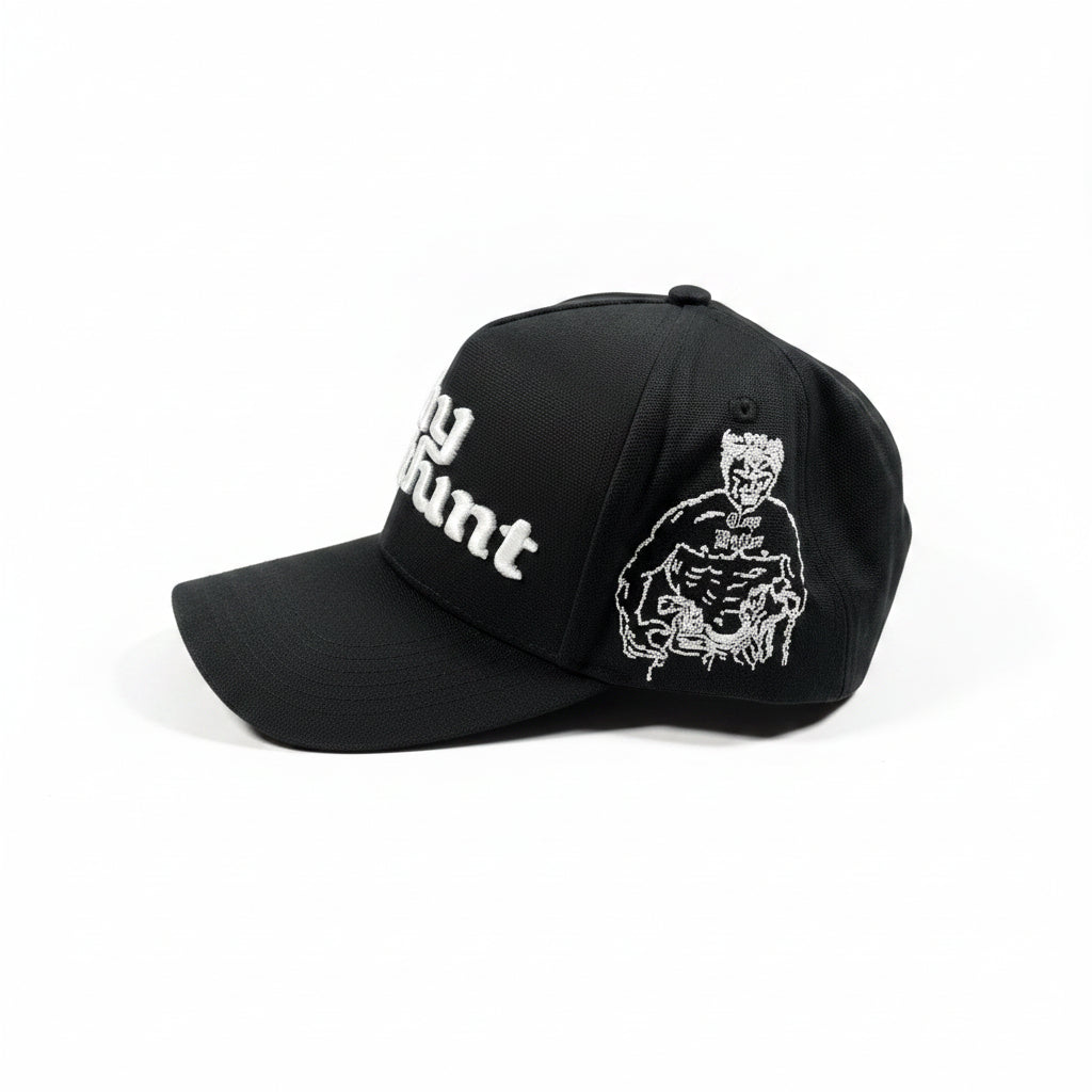 Black cap with white embroidery on a white surface