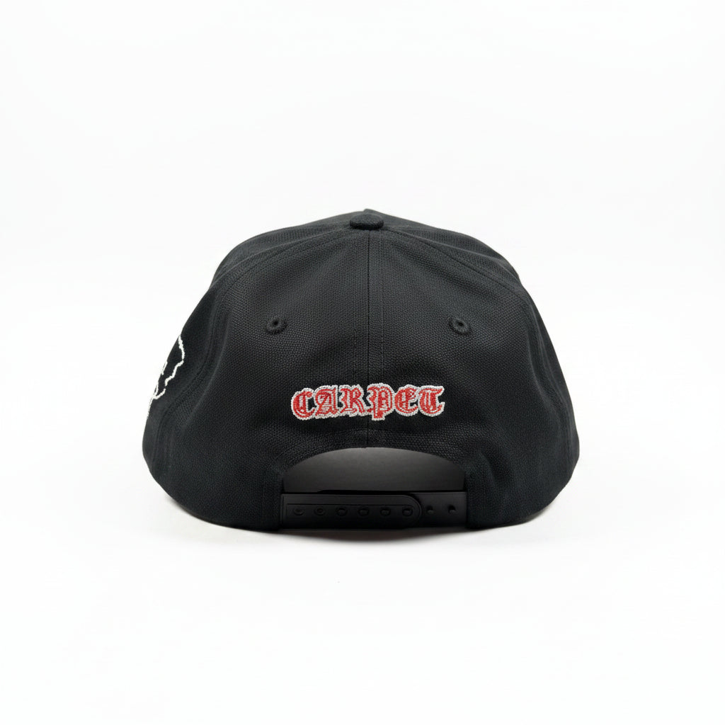 Black cap with red text on a white surface
