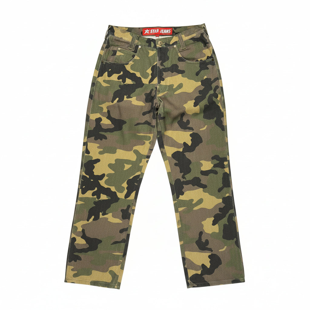 Camouflage pants on a white surface with a brand label 