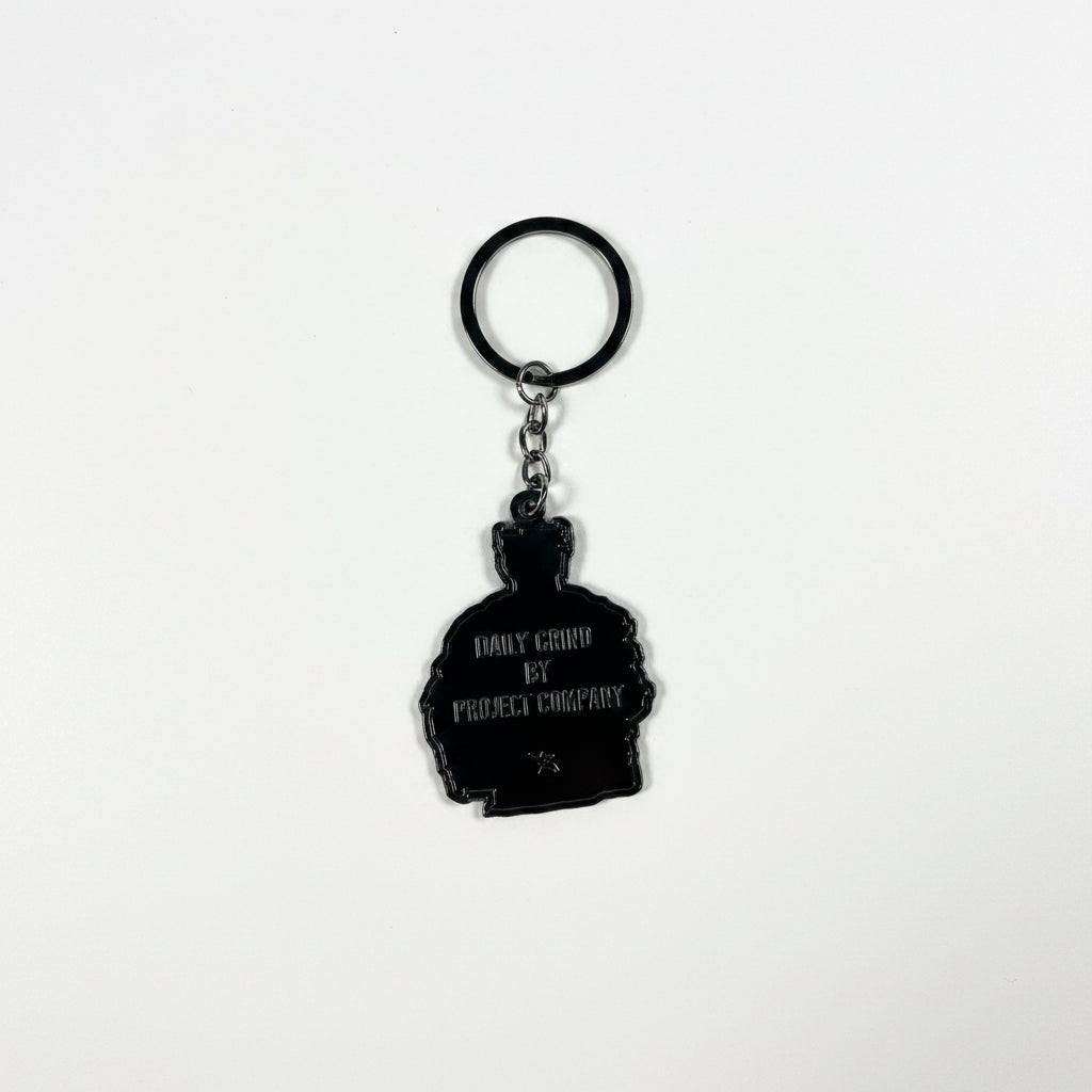 Keychain with a silhouette design on a white surface