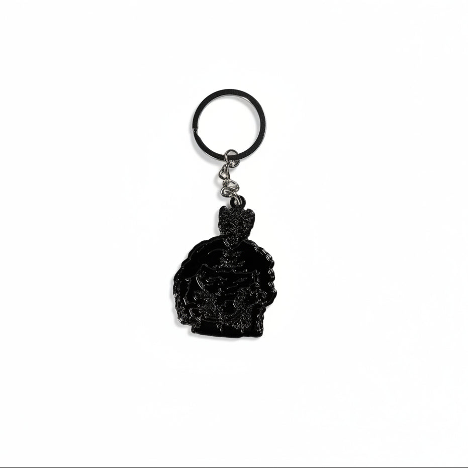 Black keychain with a muscle bound figure on a white background