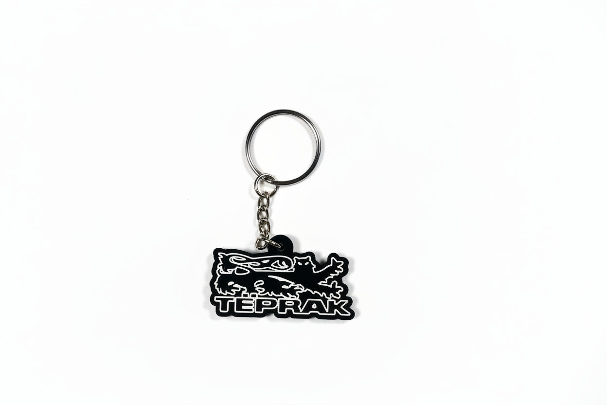 Black keychain with a logo on a white background