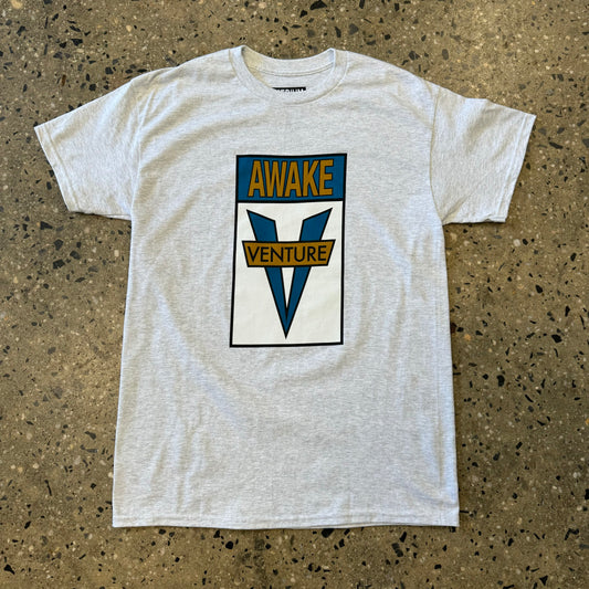 ash grey t shirt with gold/teal and white text in the center