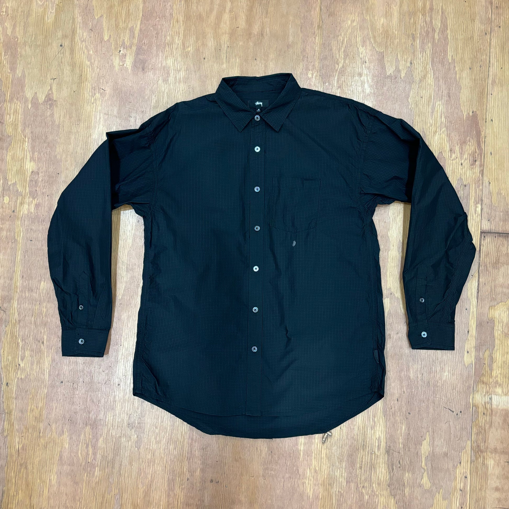 Front view of navy cordura sprayed stussy shirt