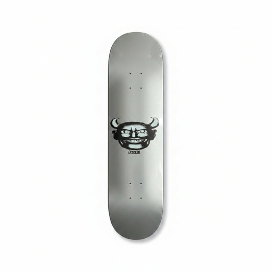 silver skateboard deck with devil man style face graphic on center of deck