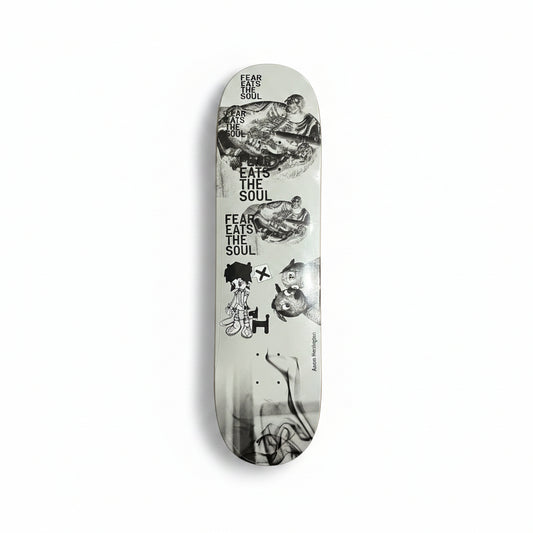 Skateboard deck with black and white graphics on a white surface