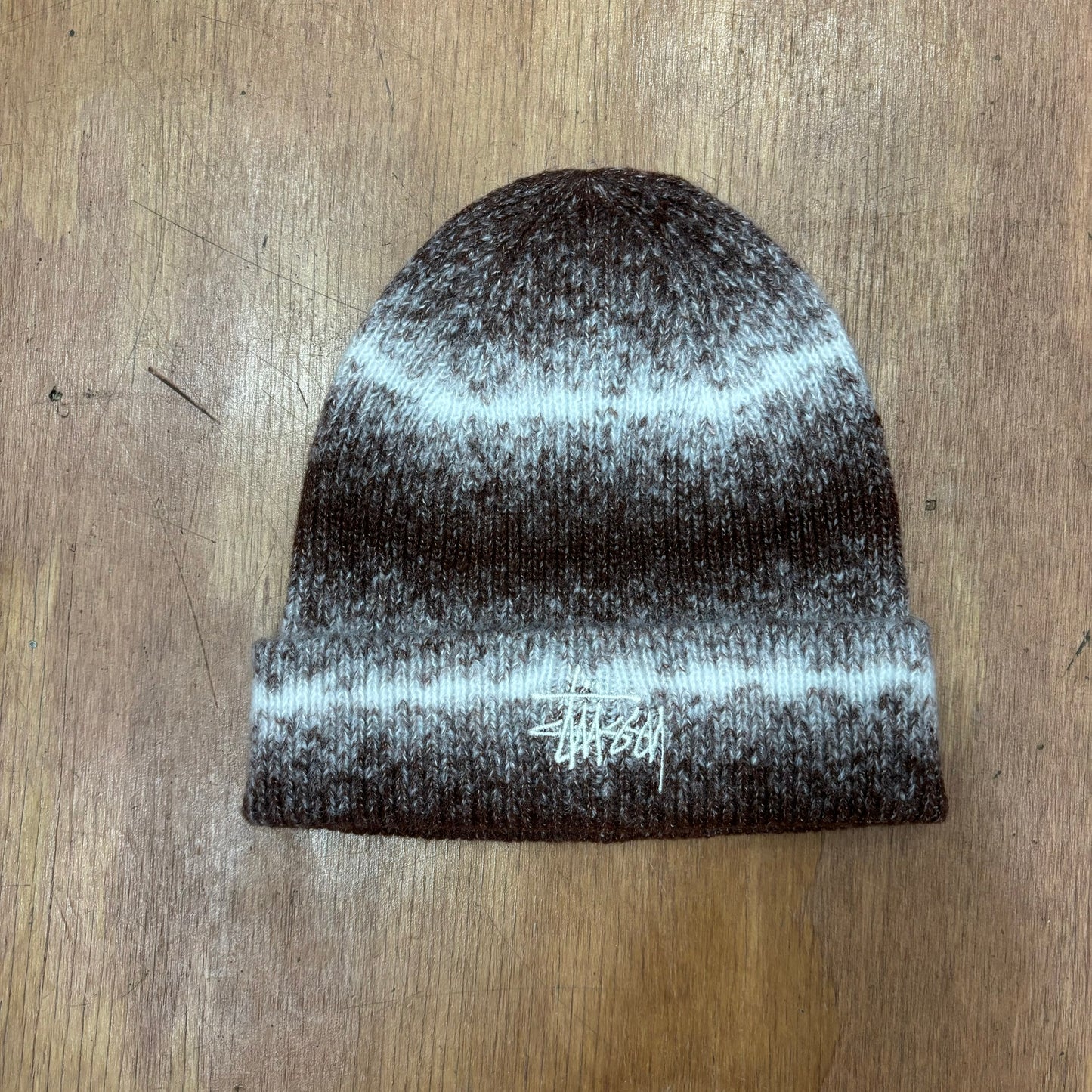 Brown and white striped stussy beanie 