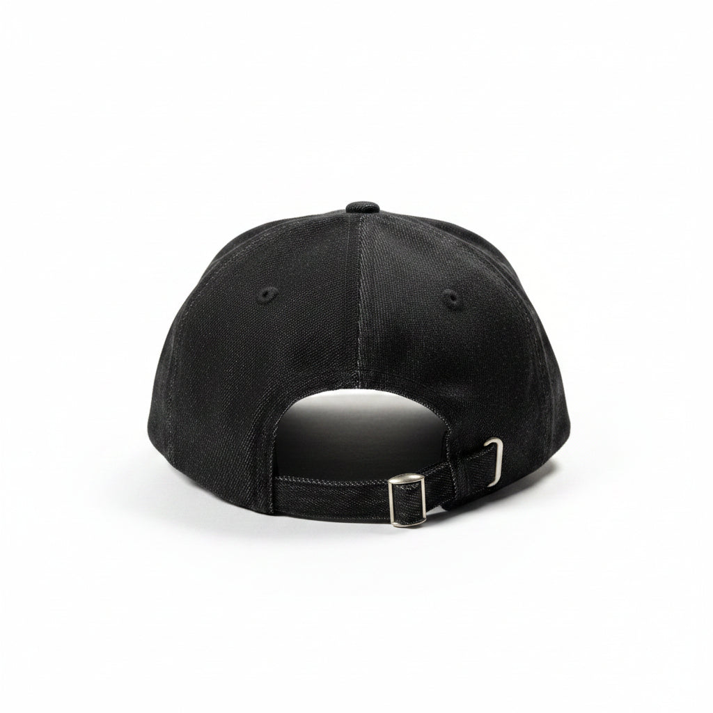 Black cap on a white surface