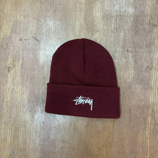 wine colored acrylic beanie with stussy logo embroidered