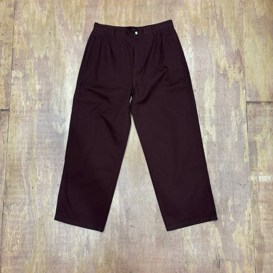 Front view of brick colored stussy chino