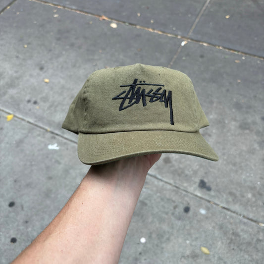 front view of STUSSY logo snapback cap