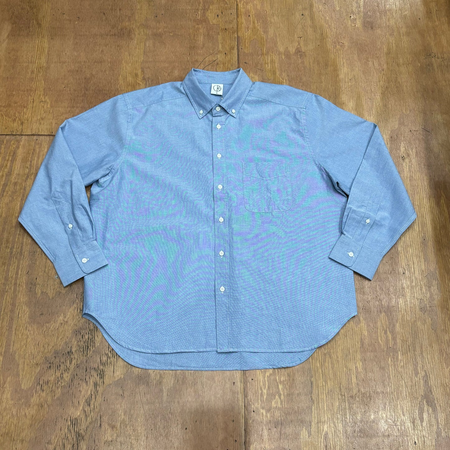 front view of blue button down shirt