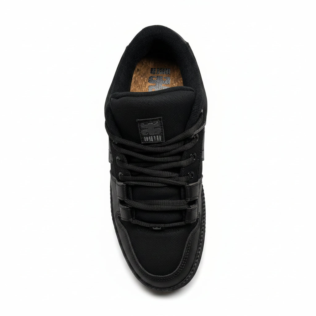 Black sneaker on a white surface