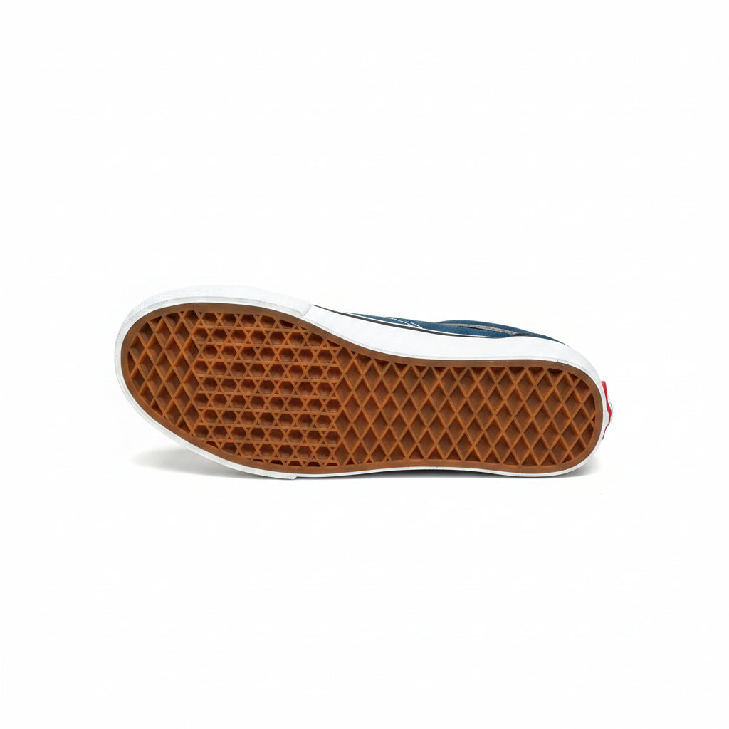 Close-up of a shoe sole with a waffle pattern on a white surface