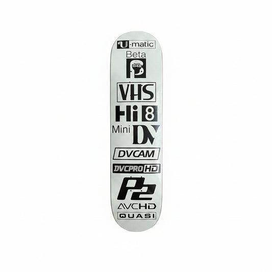 Skateboard deck with vintage technology logos on a white surface