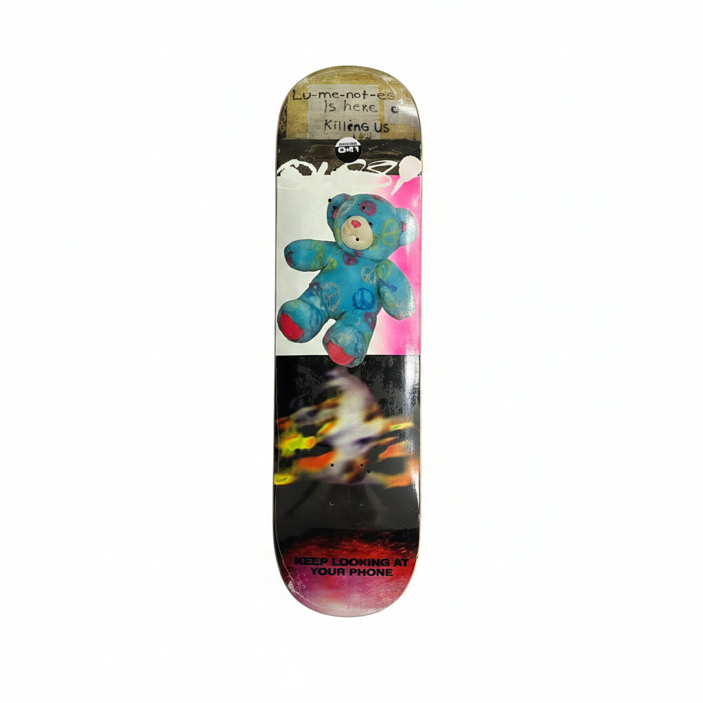 Skateboard deck with colorful bear design on a white surface
