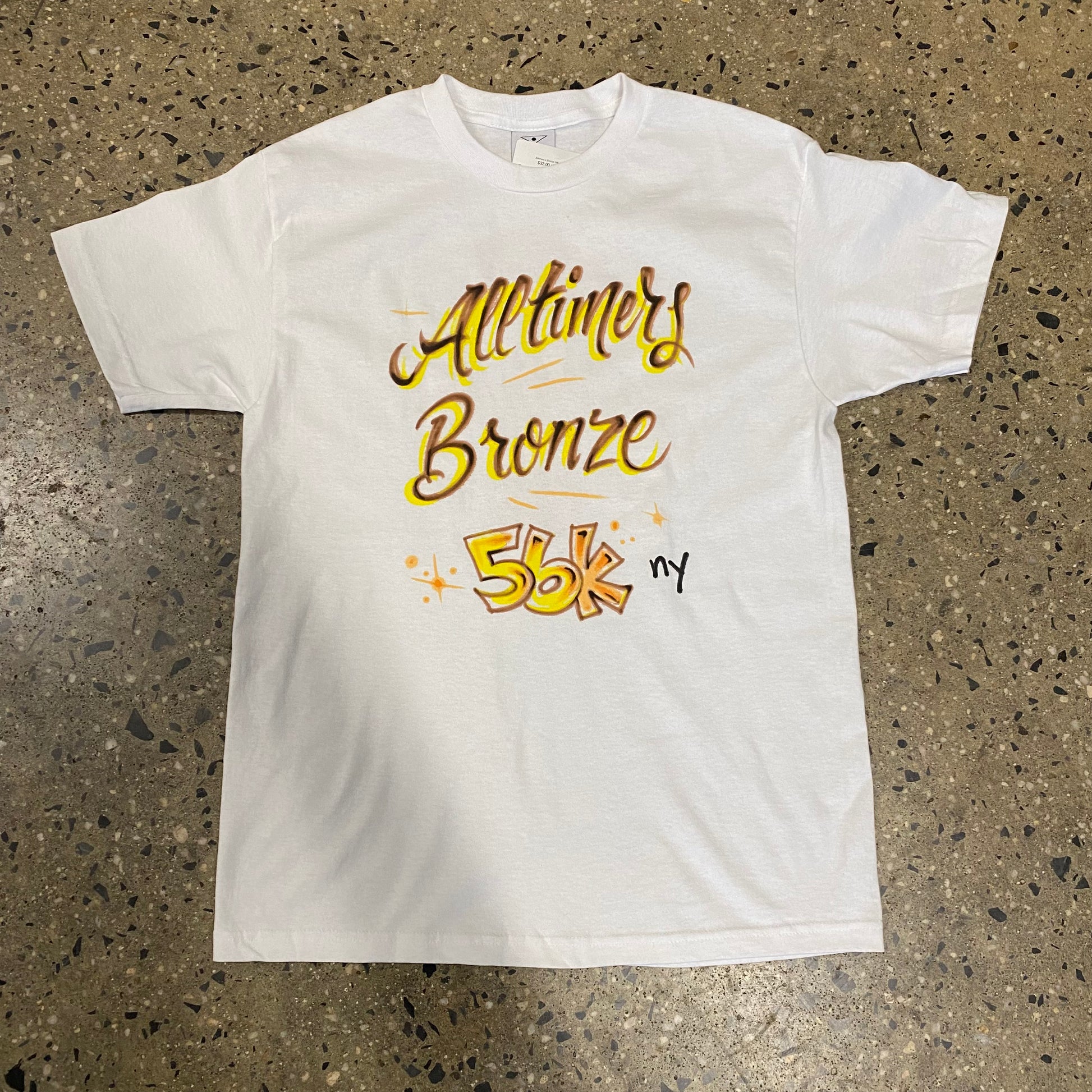 yellow and black Alltimers Bronze on white T-shirt