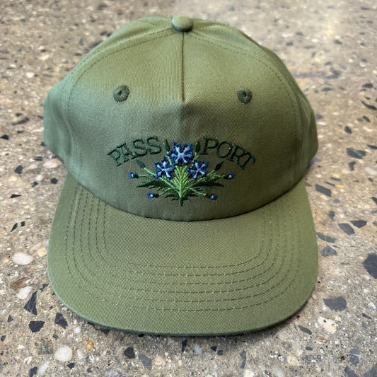 military green snapback hat with flowers in the center