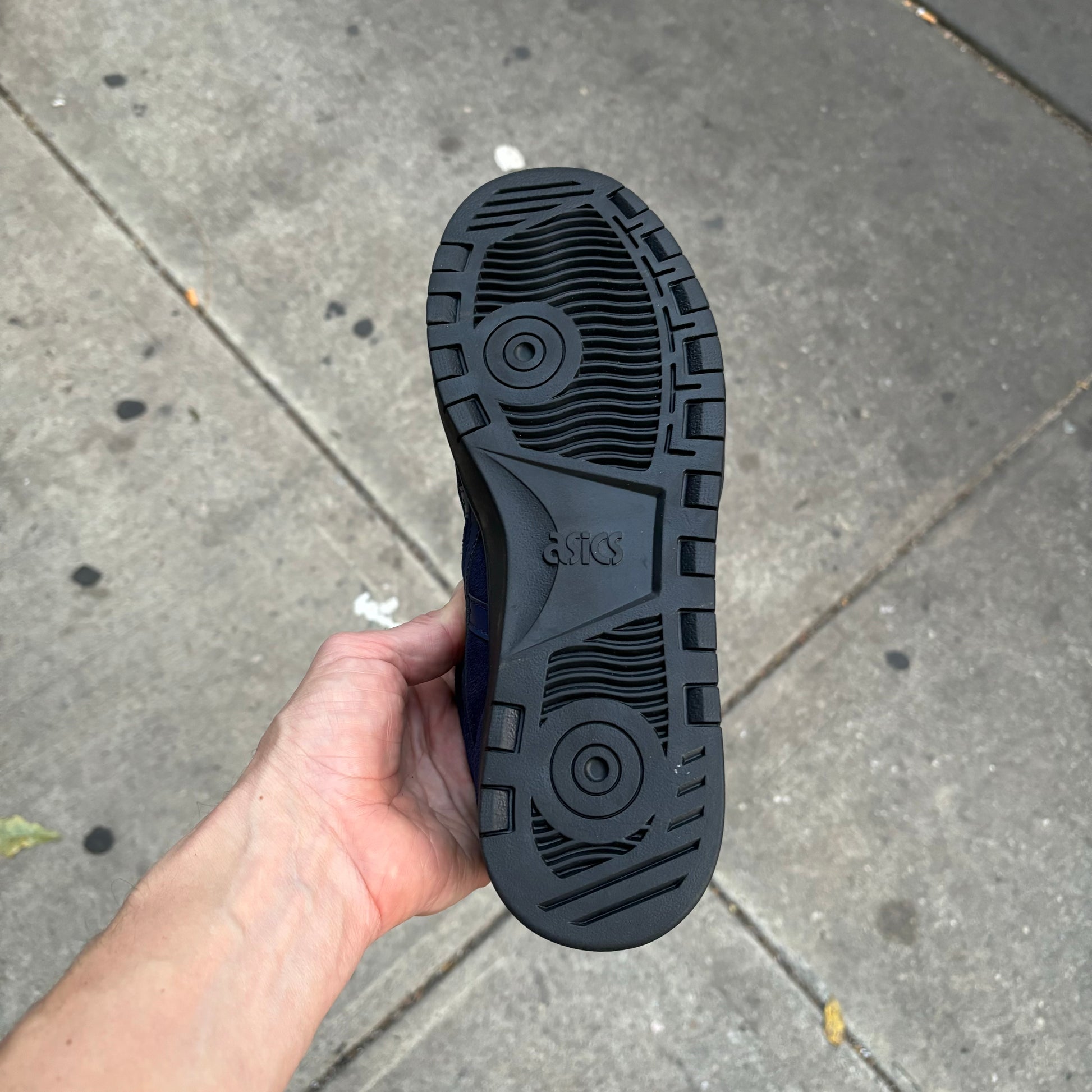 View of black outsole on skateboard sneaker