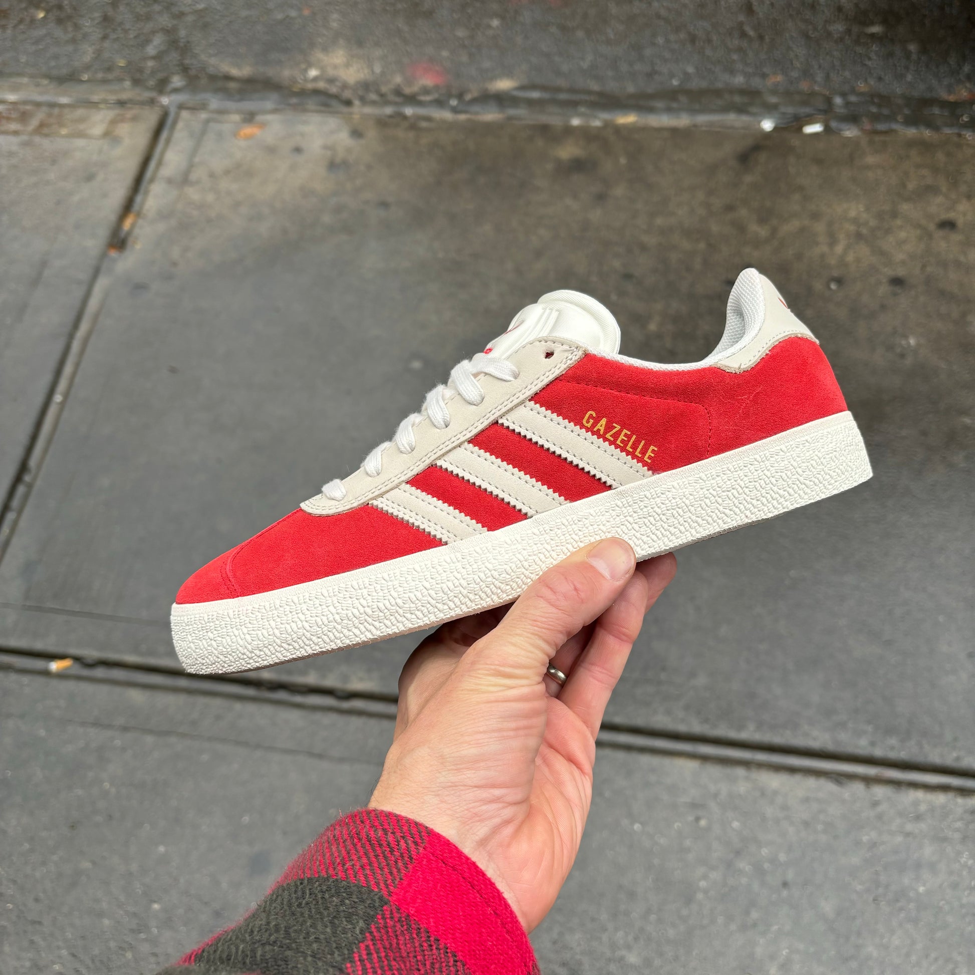 Side view of red and white suede skateboard sneaker